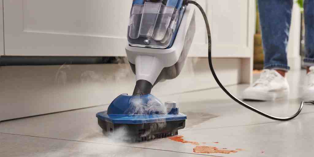 Before – stained tile floor being steam cleaned