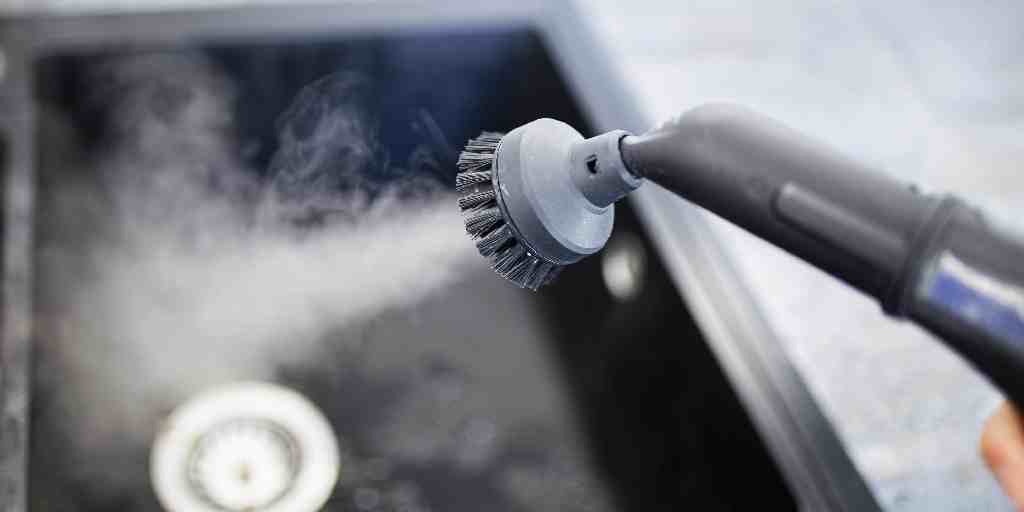 Before – kitchen surface detail being steam cleaned